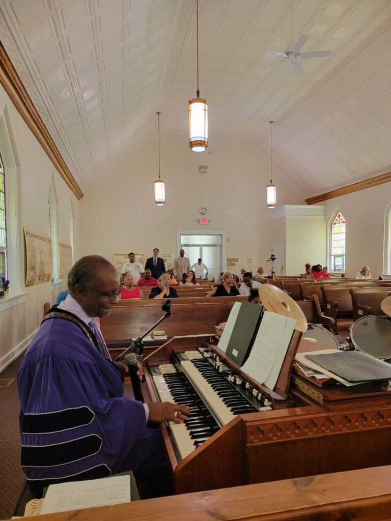 Pastor playing organ